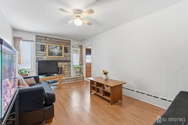 a living room with furniture and a fireplace