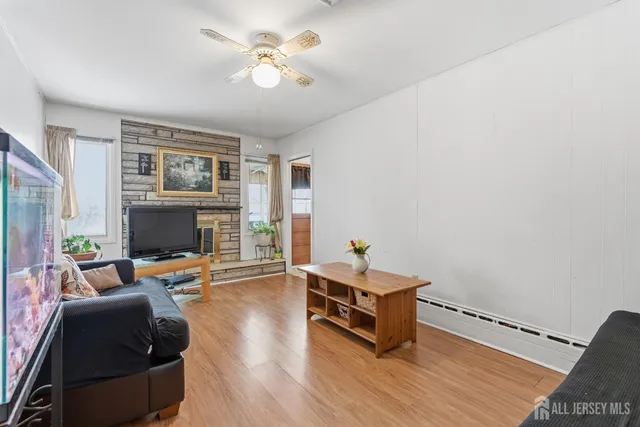 a bathroom with a granite countertop toilet sink and mirror