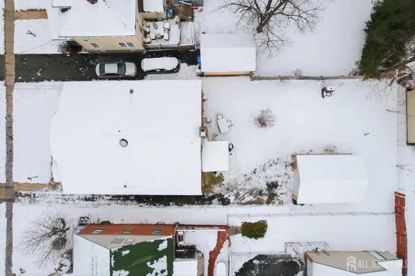 an aerial view of residential houses with yard
