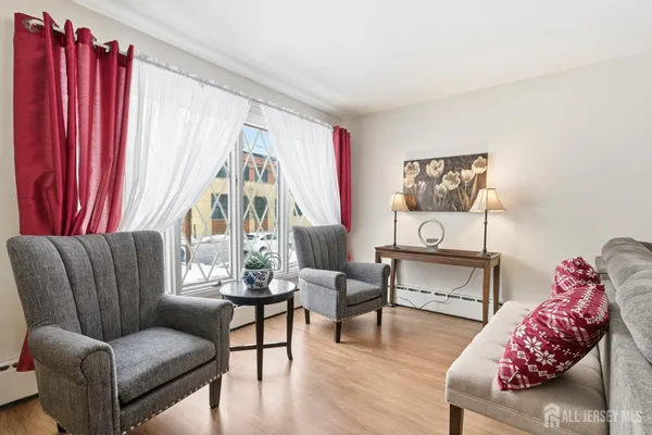 a living room with furniture and a large window