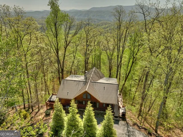 a wooden bench sitting in front of a building