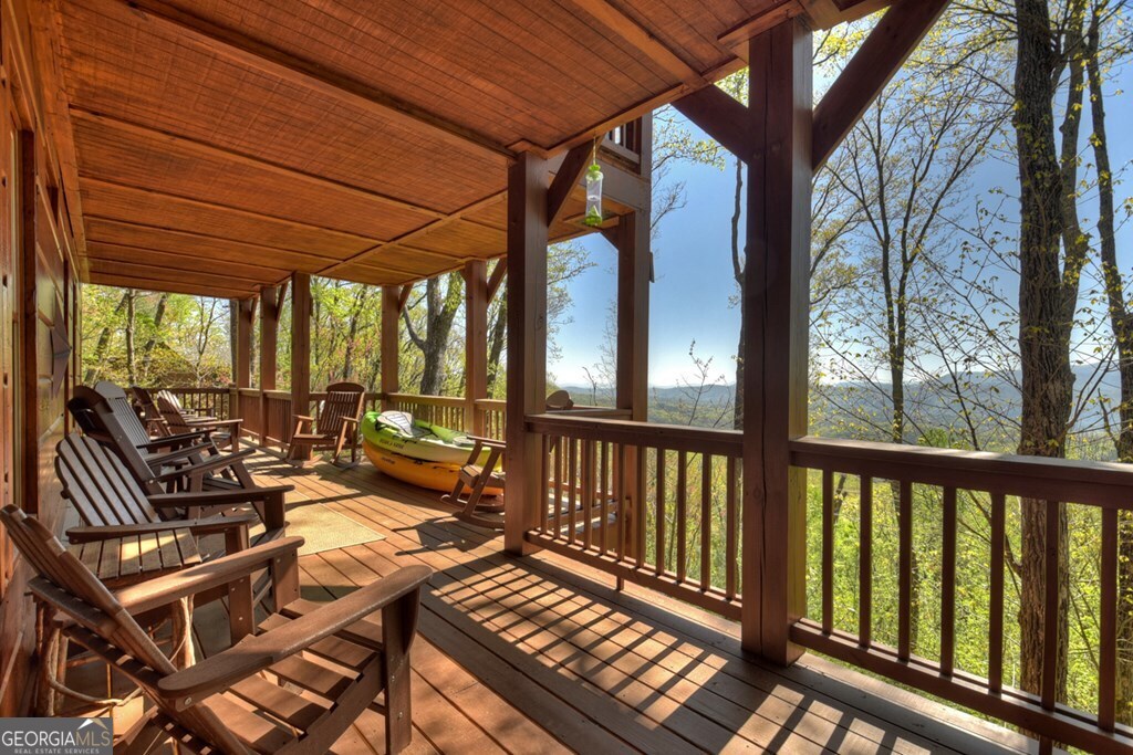 783 North Moreland Drive North Blue Ridge, GA 30513 - Photo 28 of 54 a view of a patio with wooden floor chairs and a table
