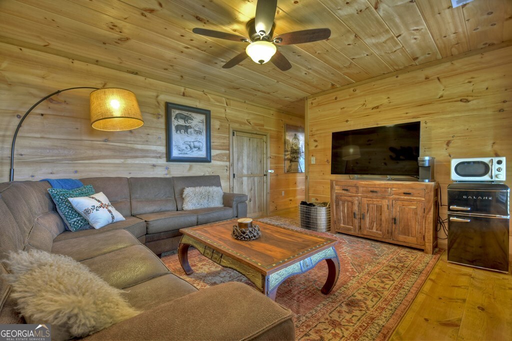 783 North Moreland Drive North Blue Ridge, GA 30513 - Photo 29 of 54 a living room with furniture and a flat screen tv