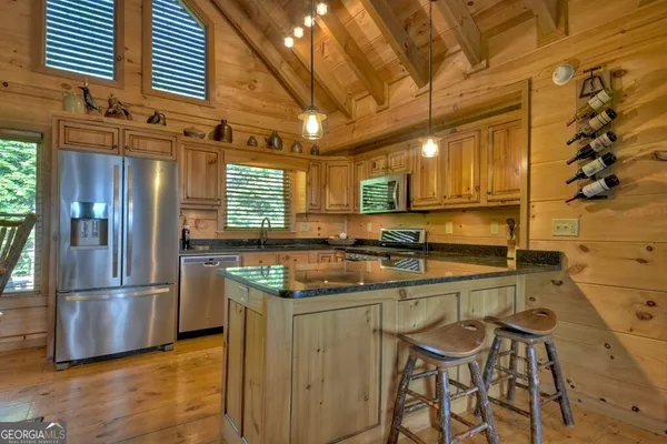 a bathroom with a sink a mirror and shower