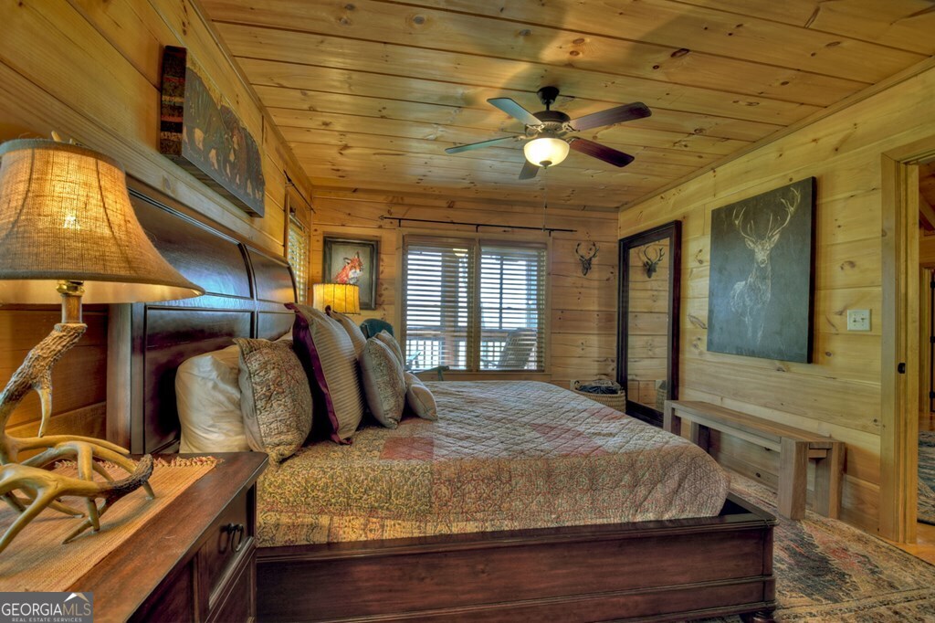 783 North Moreland Drive North Blue Ridge, GA 30513 - Photo 49 of 54 a bedroom with bed and wooden floor