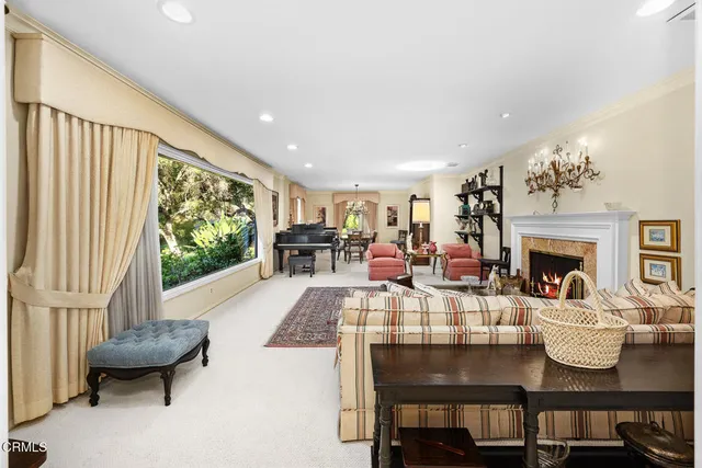 a large kitchen with stainless steel appliances granite countertop a lot of counter space and wooden floors