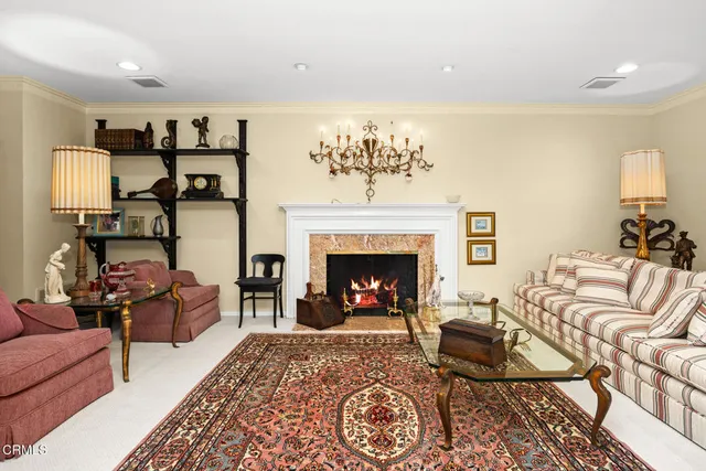 a kitchen with a stove a sink and a granite counter top