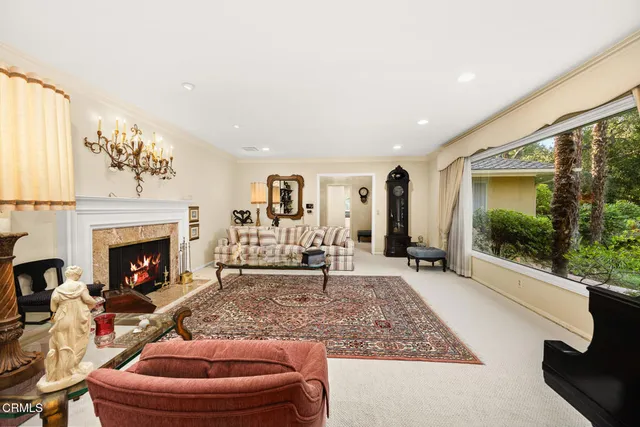 a kitchen with stainless steel appliances kitchen island granite countertop a stove a sink and a refrigerator