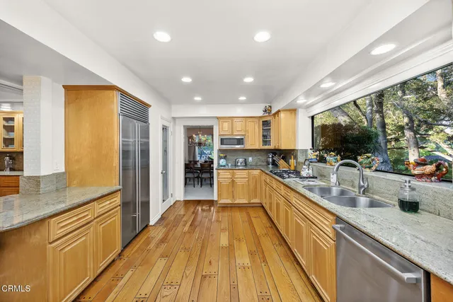a living room with furniture a lamp and a window