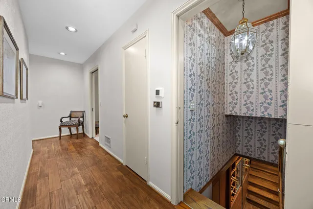 a bedroom with bed and a large window