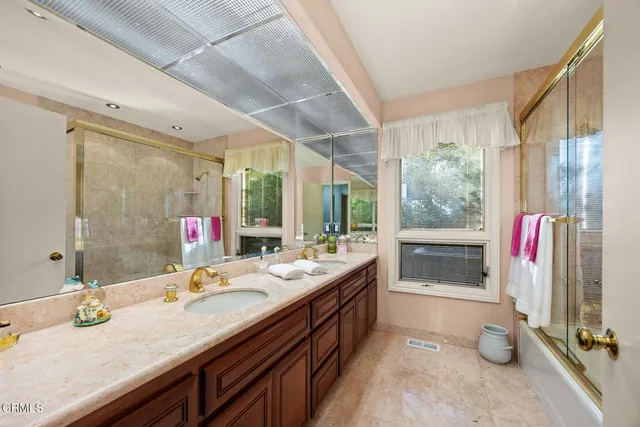a view of a chairs and table in backyard of the house