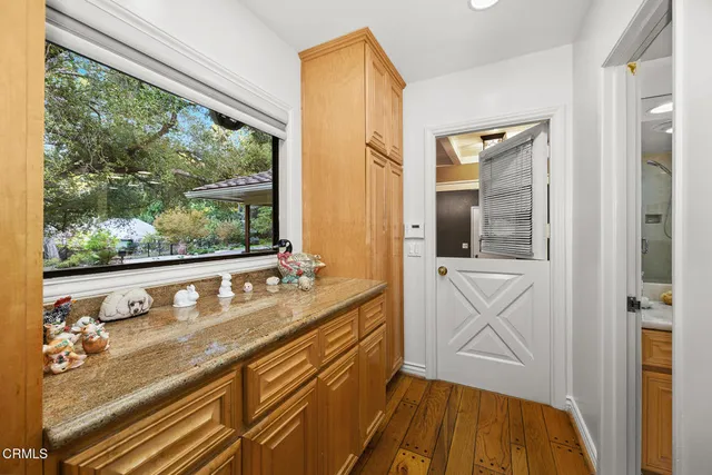 a view of a patio with table and chairs and potted plants