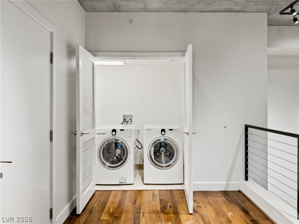360 East Desert Inn Road, Unit 607 Las Vegas, NV 89109 - Photo 39 of 55 Functional laundry nook with full-size appliances offers practical living.