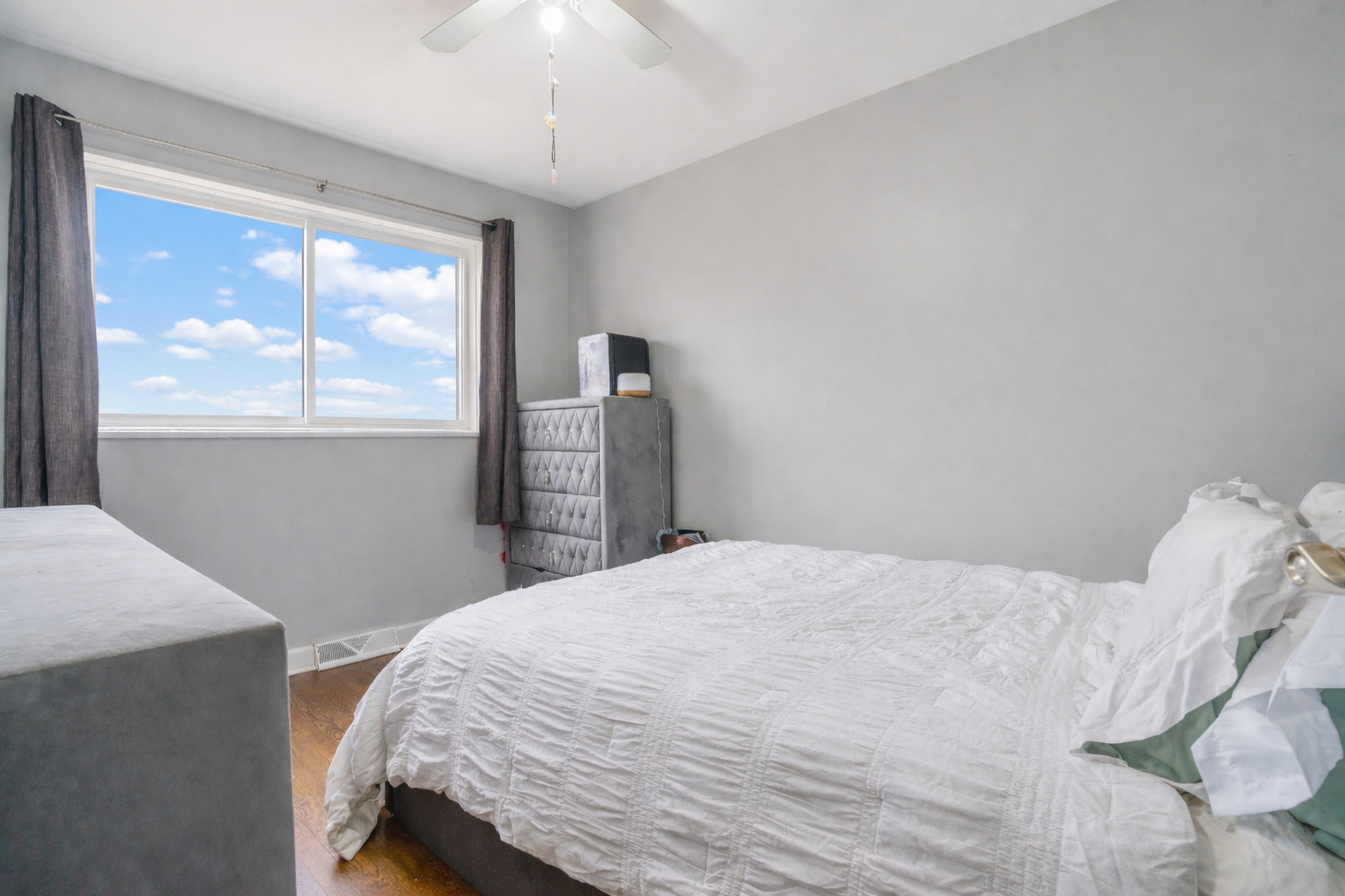 129 Rice Avenue Bellwood, IL 60104 - Photo 11 of 23 a bedroom with a bed and a window