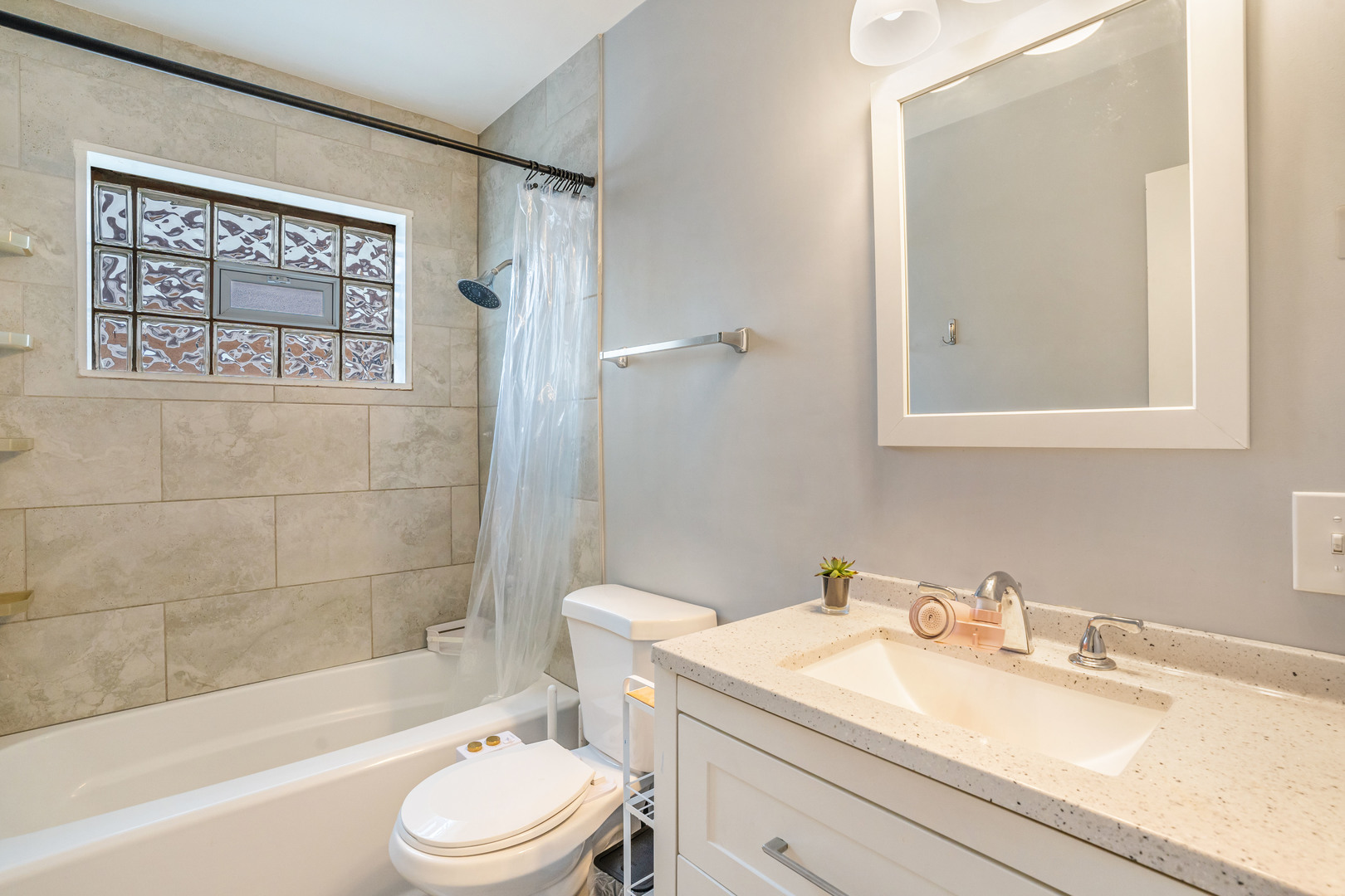 129 Rice Avenue Bellwood, IL 60104 - Photo 14 of 23 a bathroom with a sink a toilet and shower