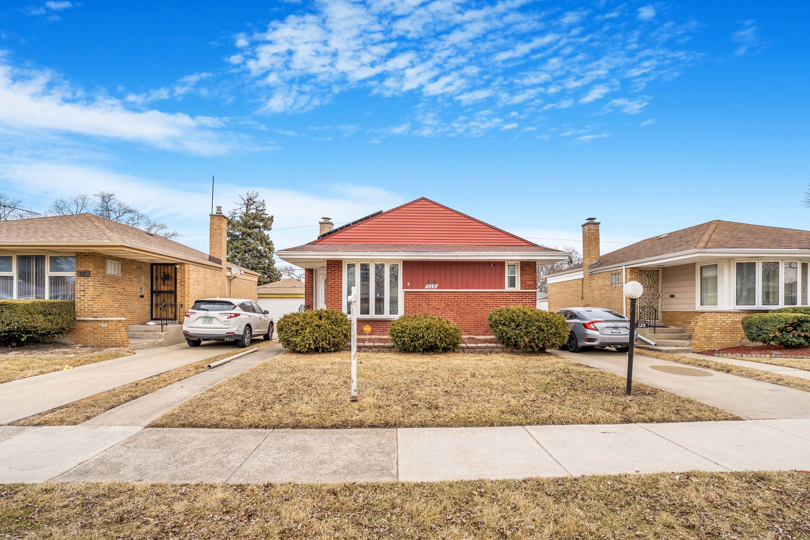 129 Rice Avenue Bellwood, IL 60104 - Photo 18 of 23 a front view of a house with a yard