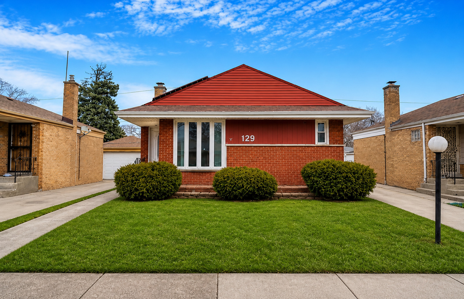 129 Rice Avenue Bellwood, IL 60104 - Photo 2 of 23 a front view of a house with garden