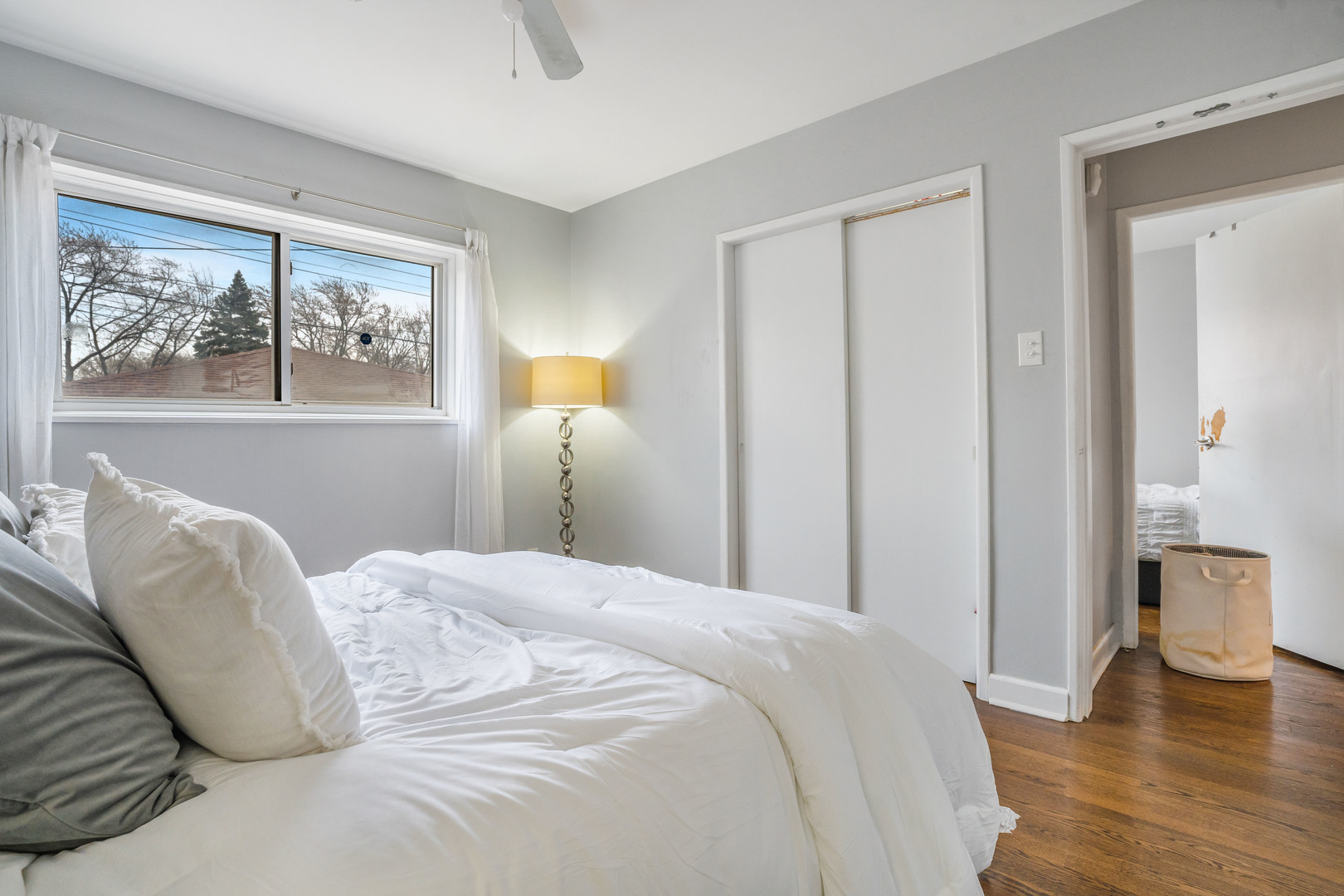 129 Rice Avenue Bellwood, IL 60104 - Photo 10 of 23 a bedroom with a bed and a painting on the wall