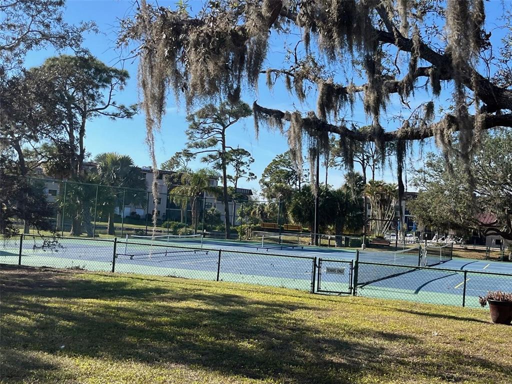 23465 Harbor View Road, Unit 1006 Punta Gorda, FL 33980 - Photo 32 of 36 a view of a swimming pool with an outdoor space and seating area