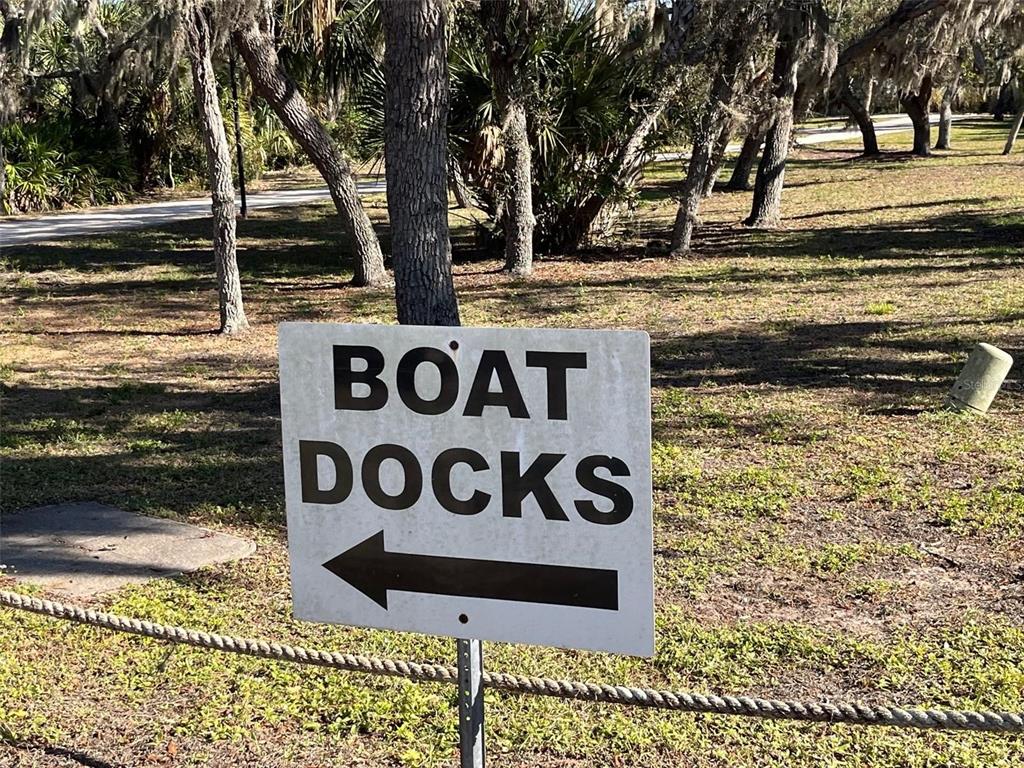 23465 Harbor View Road, Unit 1006 Punta Gorda, FL 33980 - Photo 33 of 36 a sign that is sitting on a brick wall