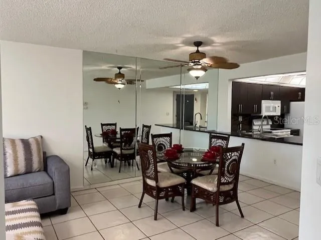 a view of a dining room with furniture and chandelier