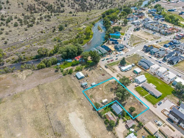 an aerial view of residential houses with outdoor space
