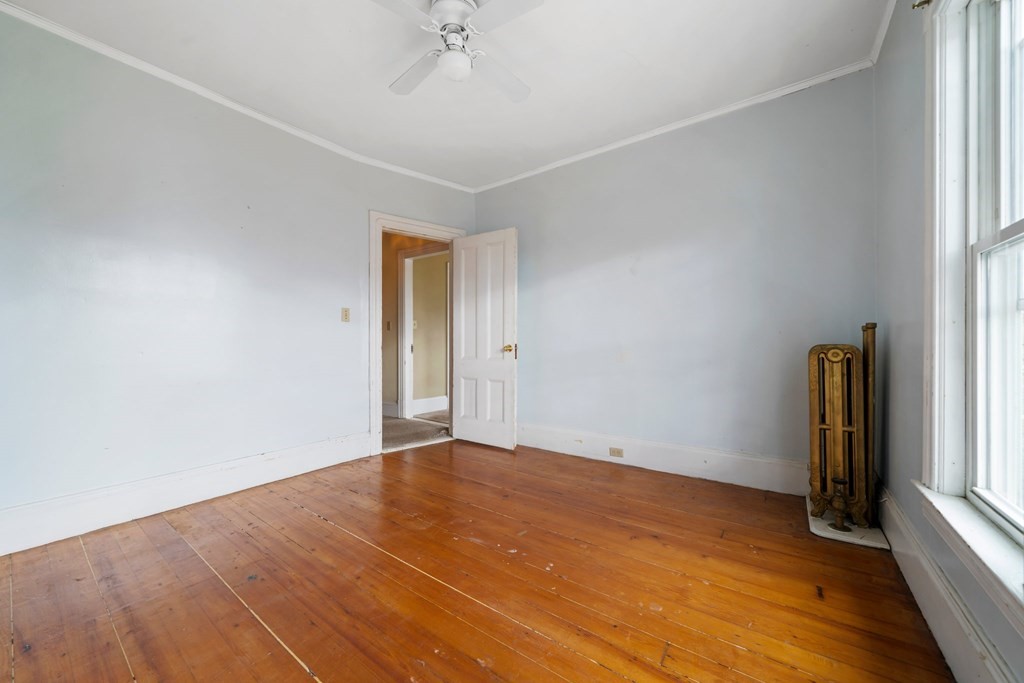 151 Lincoln Street Holyoke, MA 01040 - Photo 16 of 40 wooden floor in an empty room with a window