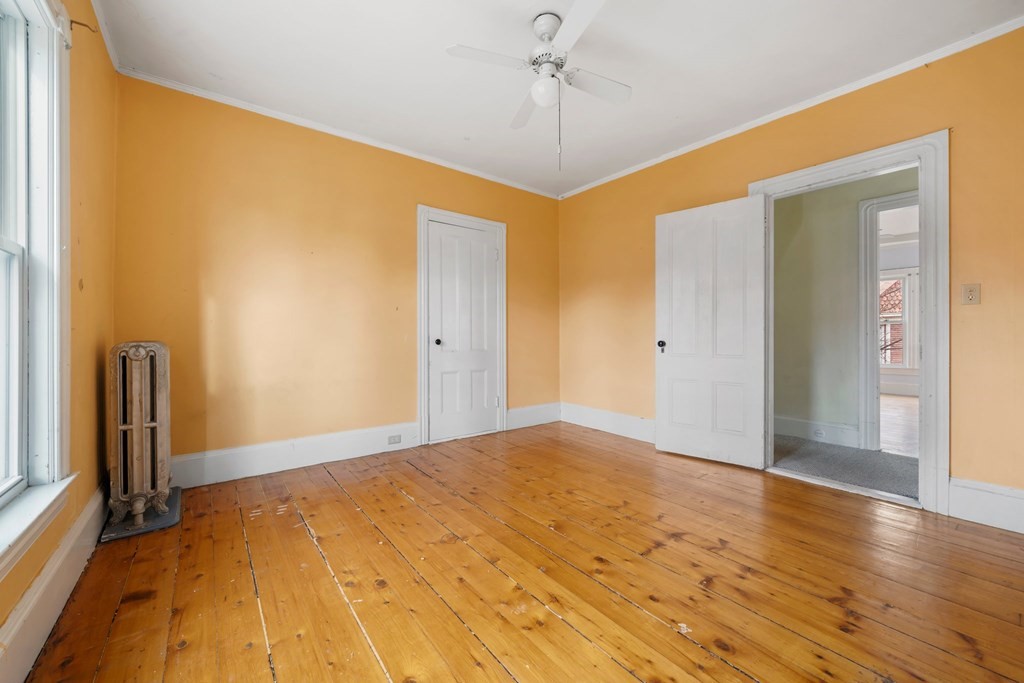 151 Lincoln Street Holyoke, MA 01040 - Photo 18 of 40 a view of empty room with wooden floor