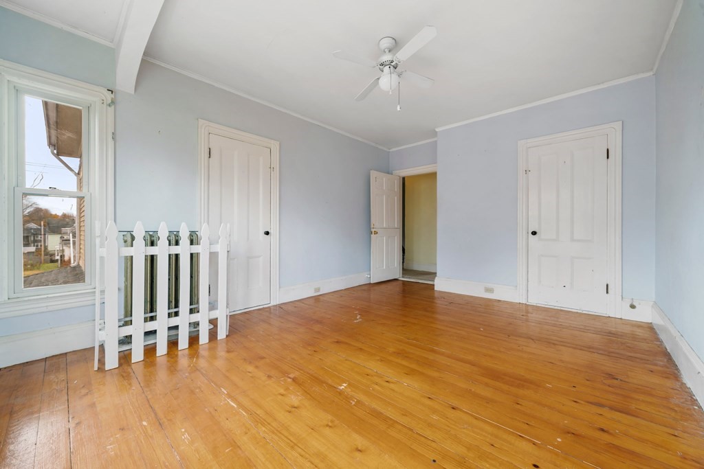151 Lincoln Street Holyoke, MA 01040 - Photo 20 of 40 a view of empty room with wooden floor