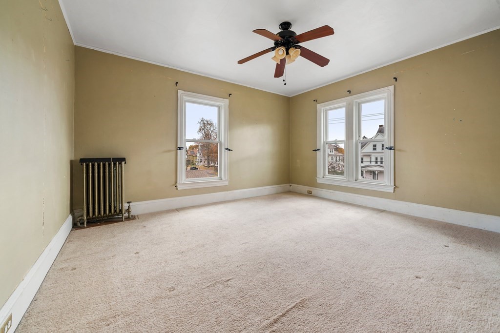 151 Lincoln Street Holyoke, MA 01040 - Photo 21 of 40 a view of a livingroom with a chandelier fan and windows