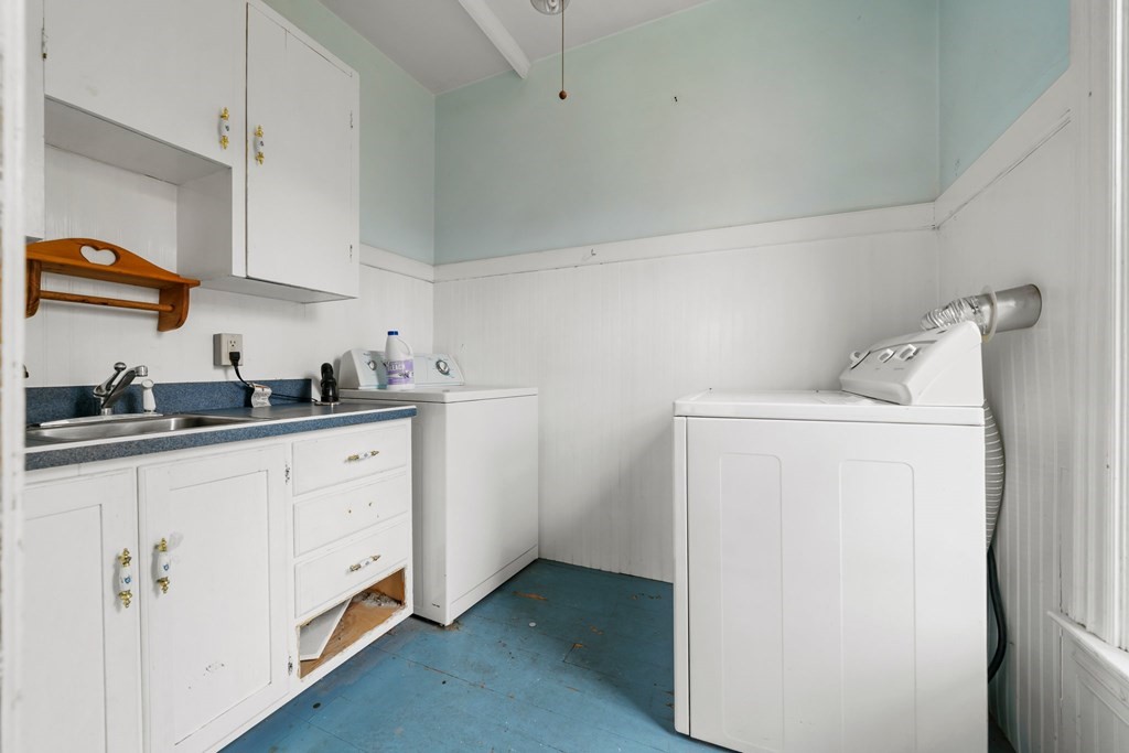 151 Lincoln Street Holyoke, MA 01040 - Photo 24 of 40 a kitchen with cabinets and white appliances