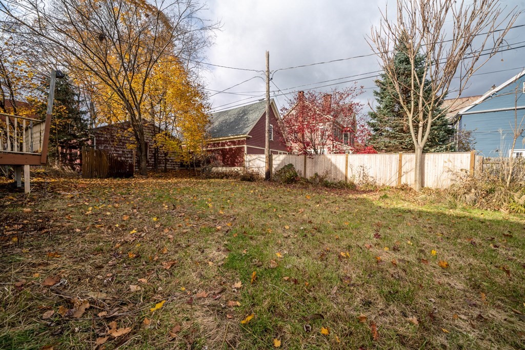151 Lincoln Street Holyoke, MA 01040 - Photo 36 of 40 a view of a yard with a house and a large tree
