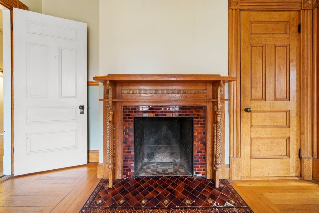 151 Lincoln Street Holyoke, MA 01040 - Photo 9 of 40 a room with fireplace and a window