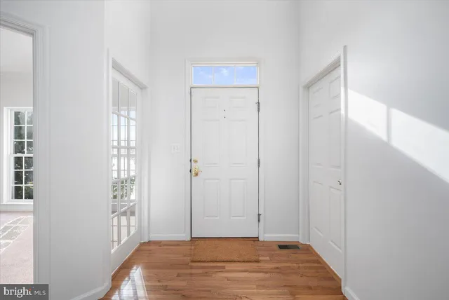 a view of a hallway with stairs