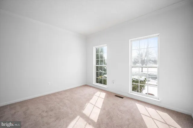 a kitchen with stainless steel appliances granite countertop a stove a sink dishwasher and a microwave oven with large wooden cabinets