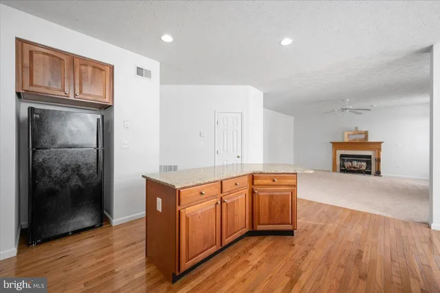 a view of a livingroom with furniture and a ceiling fan