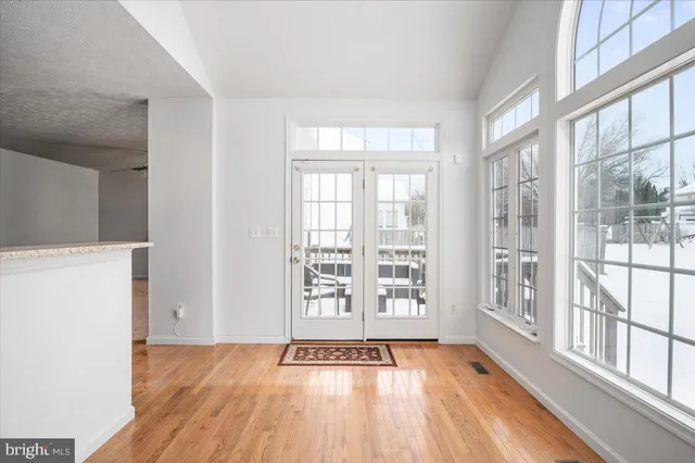 a view of staircase with white walls and a window