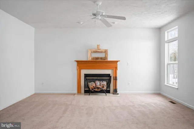 a view of a hallway with windows and stairs