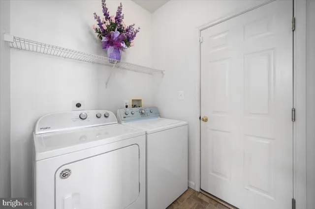 a white bath tub sitting next to a bathroom sink