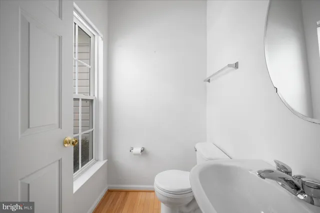 a bathroom with a tub a sink and mirror