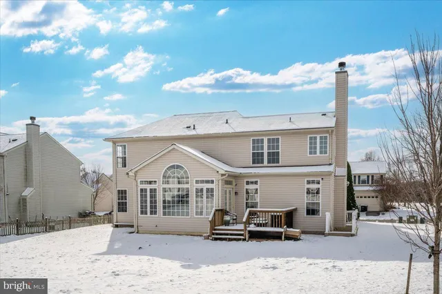 a view of a room with wooden floor and stairs