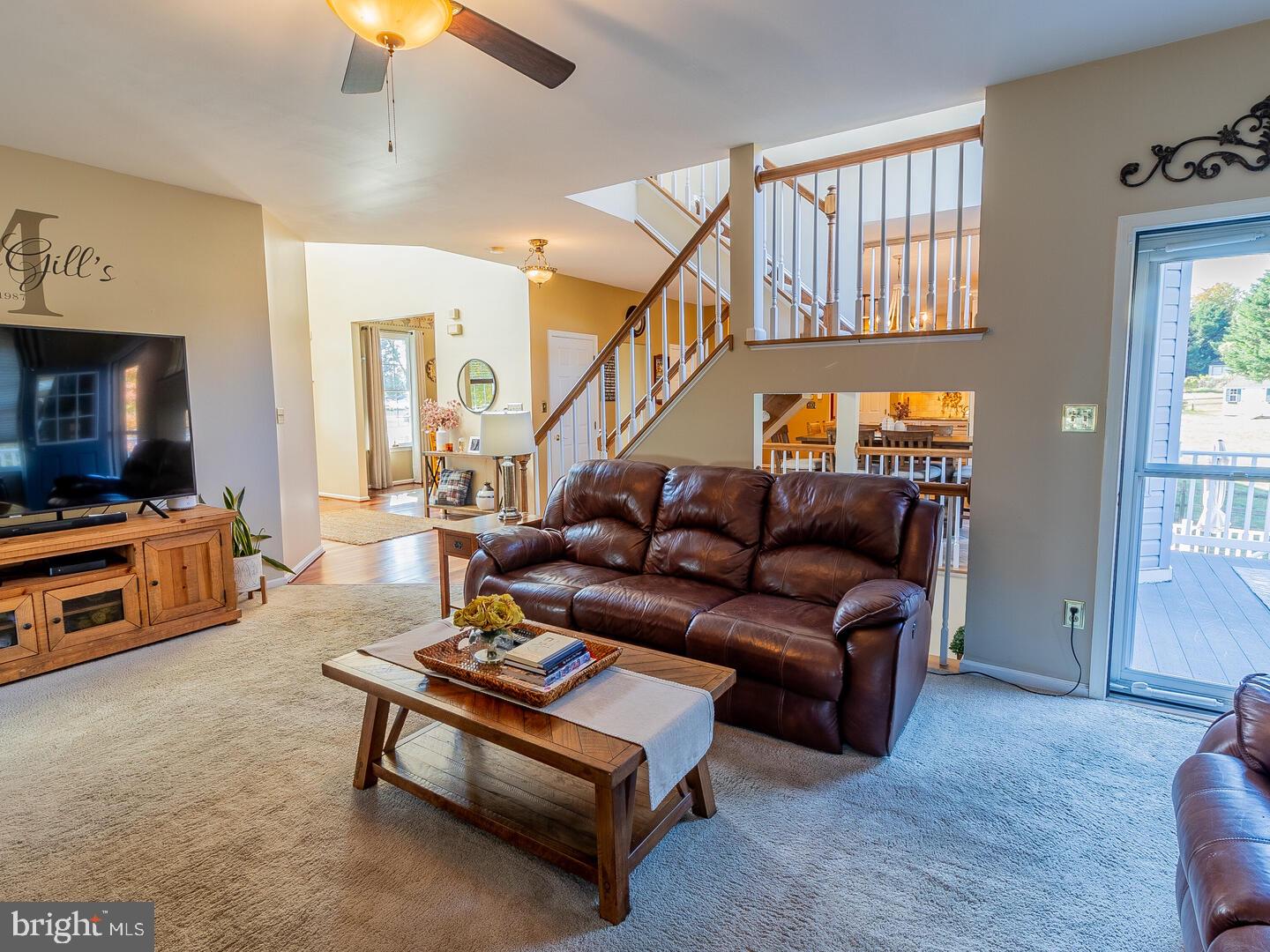 63 Emerald Ridge Drive Bear, DE 19701 - Photo 27 of 78 a living room with furniture and a flat screen tv