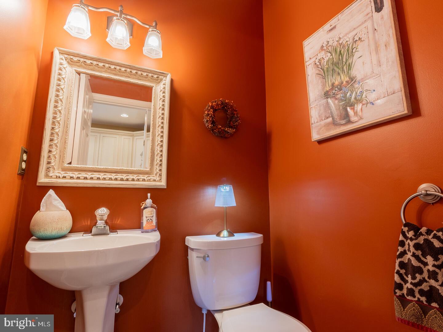 63 Emerald Ridge Drive Bear, DE 19701 - Photo 31 of 78 a bathroom with a toilet a sink and mirror