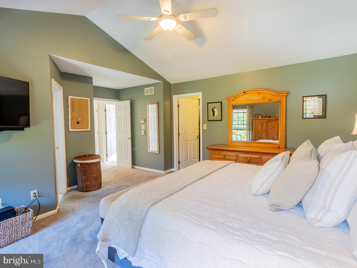 63 Emerald Ridge Drive Bear, DE 19701 - Photo 35 of 78 a bedroom with a bed and a flat tv screen on dresser
