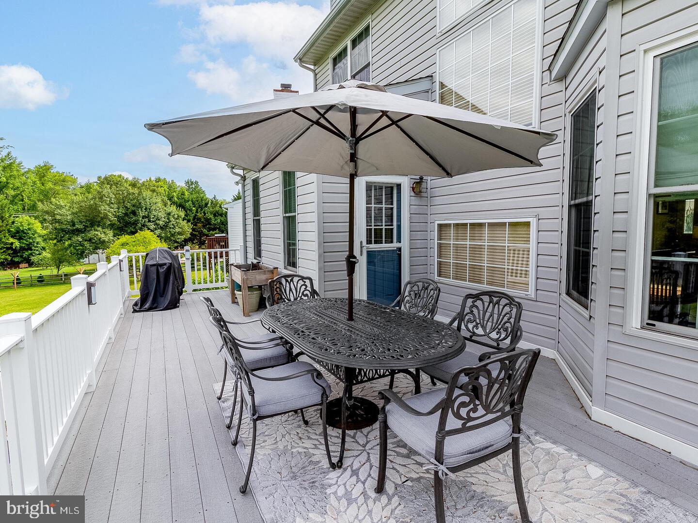 63 Emerald Ridge Drive Bear, DE 19701 - Photo 8 of 78 a view of a wooden chairs and table in the terrace