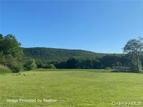 a view of a house with a big yard