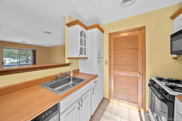 a kitchen with stainless steel appliances granite countertop a stove and a refrigerator