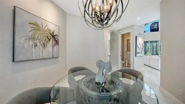 a large kitchen with a table and chairs