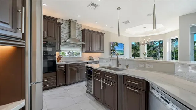 a large white kitchen with a large window