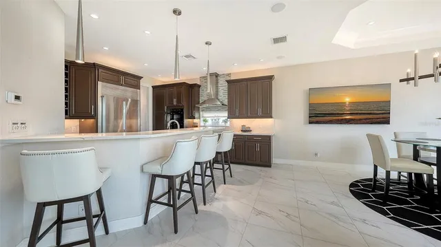 a kitchen with granite countertop cabinets stove and washer